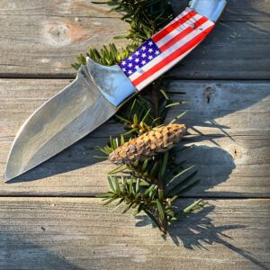 Steve Rick Skinner Knife With a Handle Featuring the USA Flag .